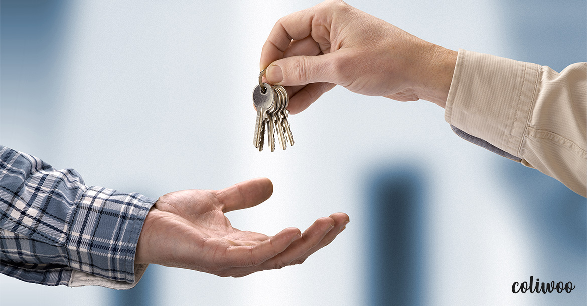 person-handing-keys-to-another-person