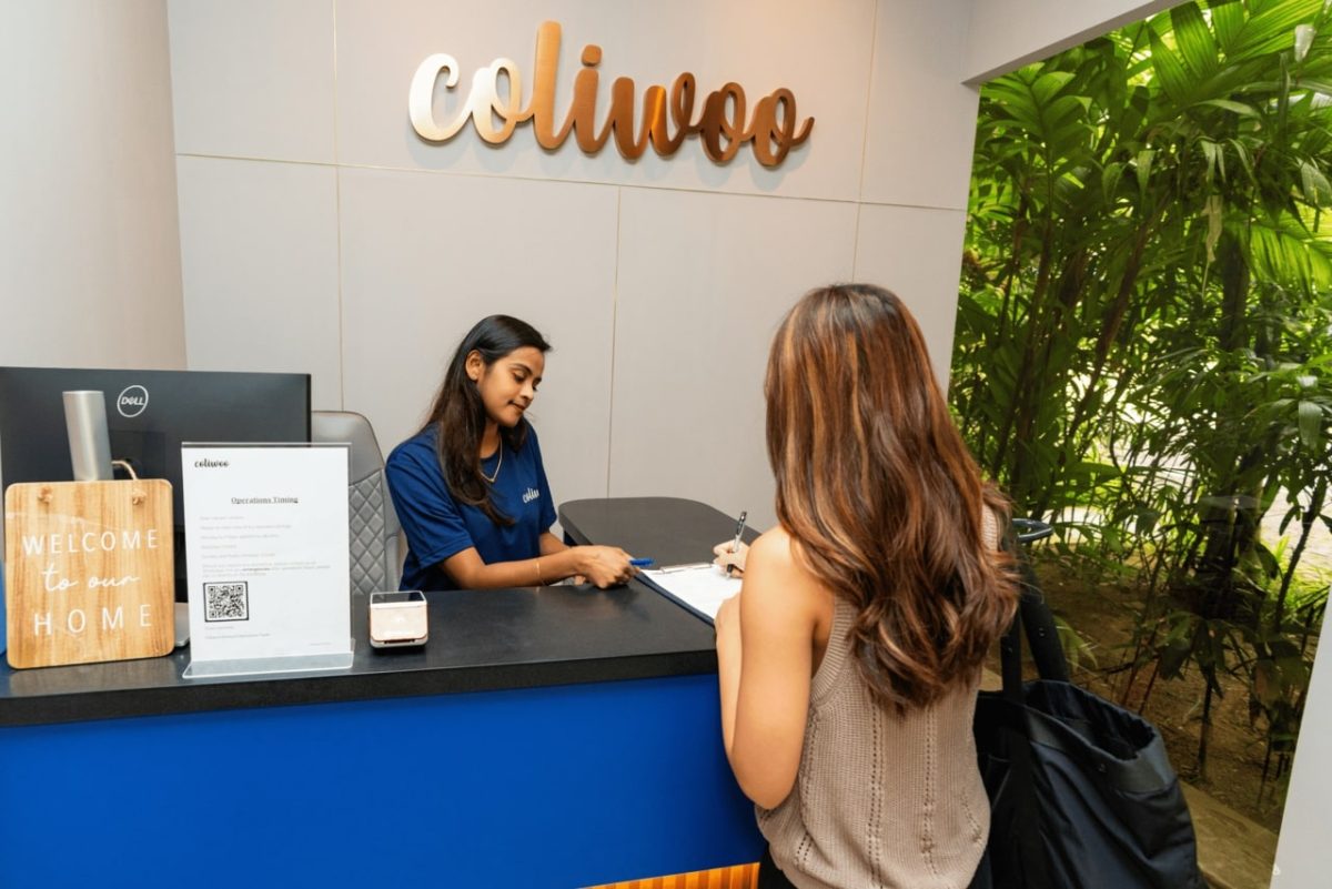 A Tourist Registering with the Receptionist