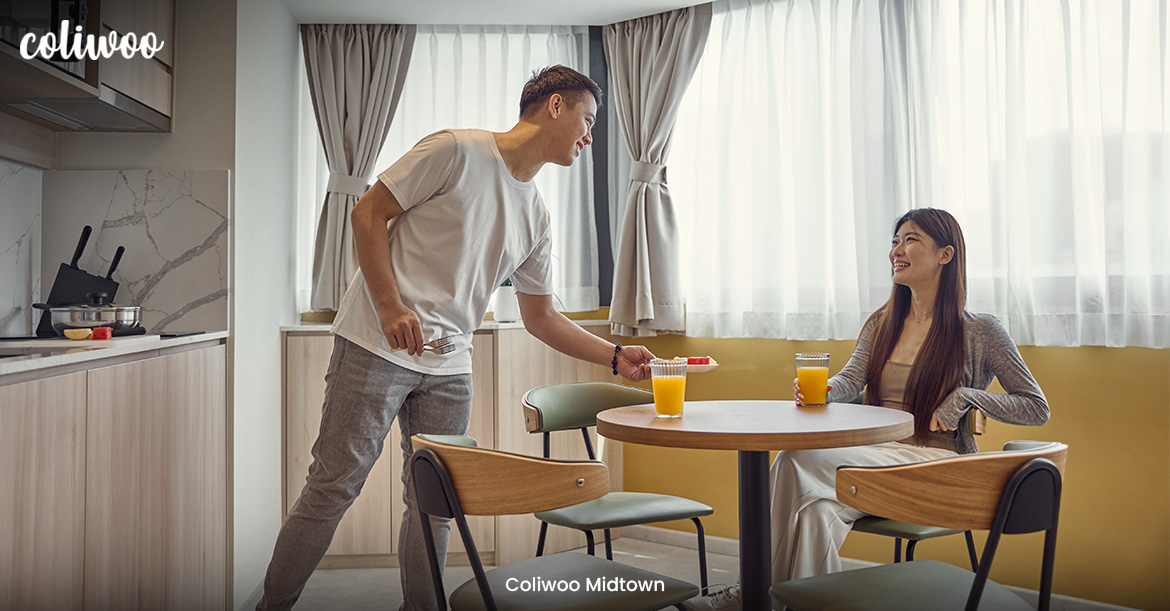 Couple sharing a meal in a Coliwoo coliving suite.